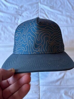 Prana Topographic Pattern Trucker Hat in Dark Teal with Orange Accent